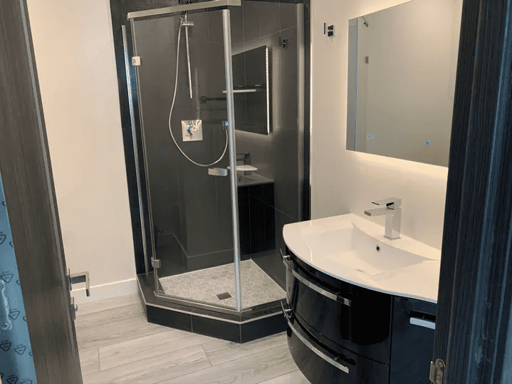 black and white bathroom with standing shower