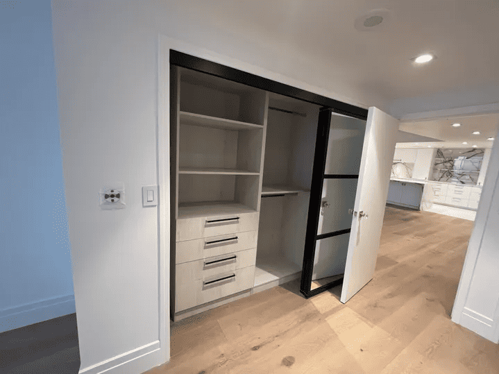 large closet with a lot of storage shelves