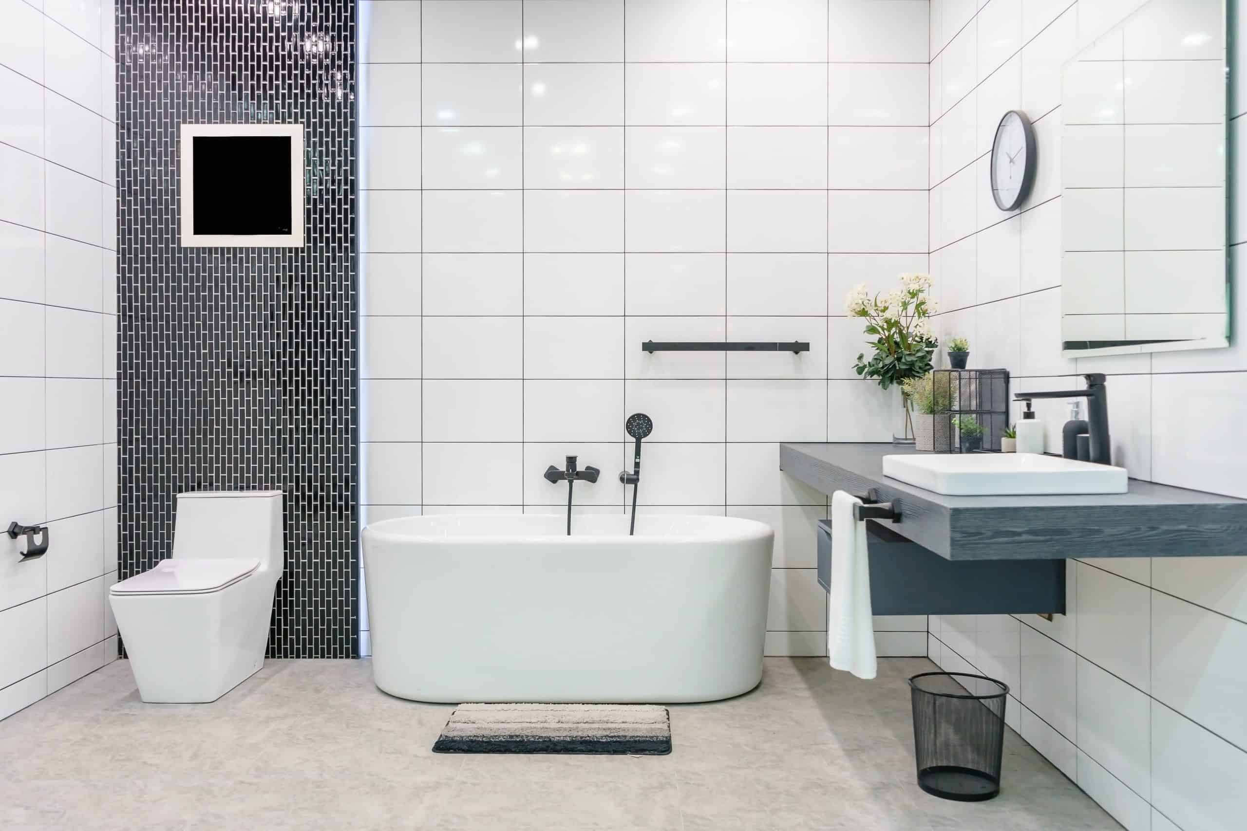 contemporary master bathroom with white and black fixtures.